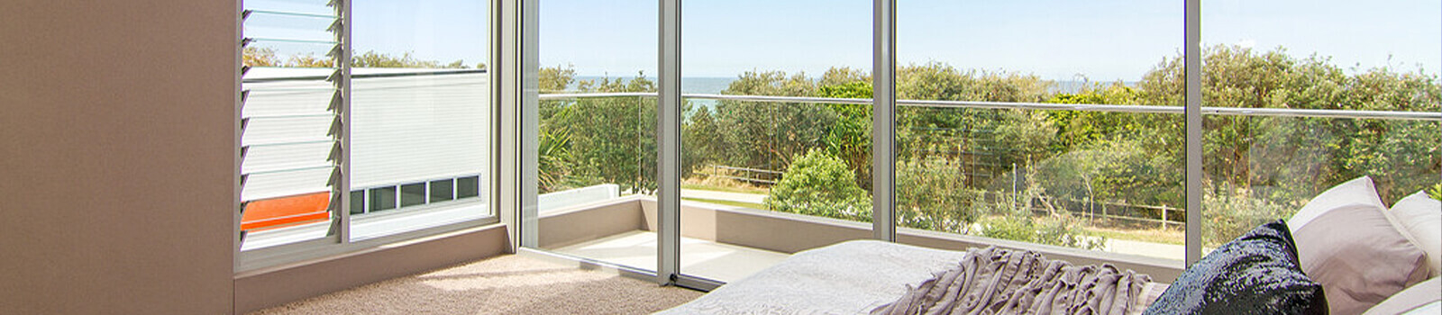 View from bedroom with large oceanfront windows