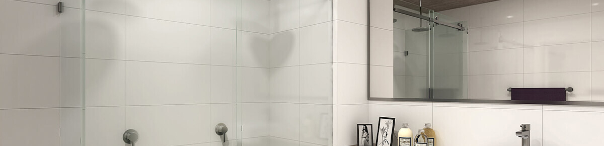 Modern frameless glass shower screen in bathroom