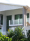 Beach house with glass windows, doors and fencing